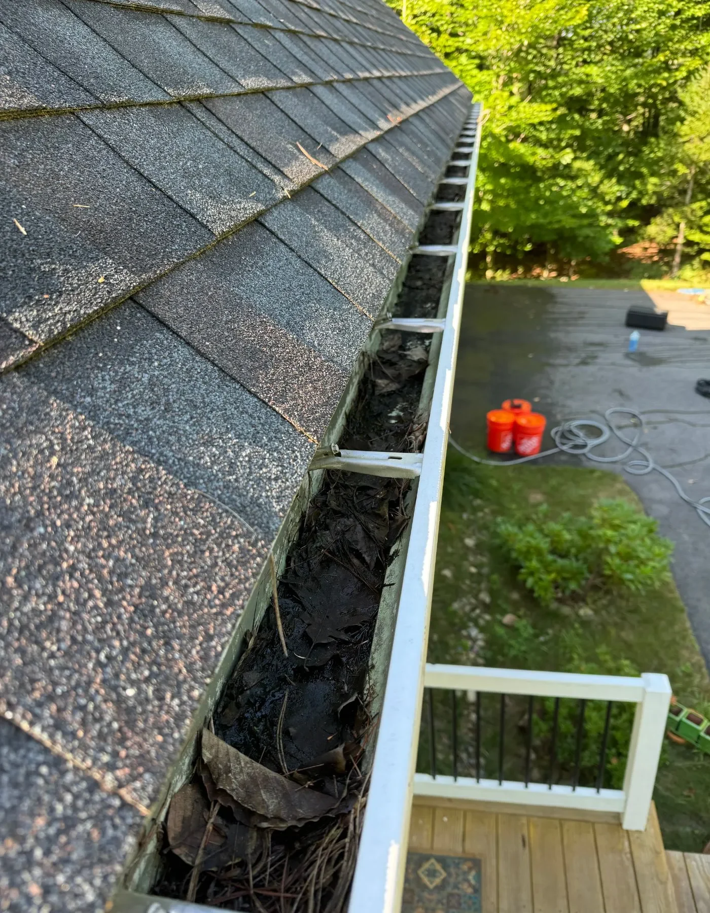 Gutter packed with debris before cleaning