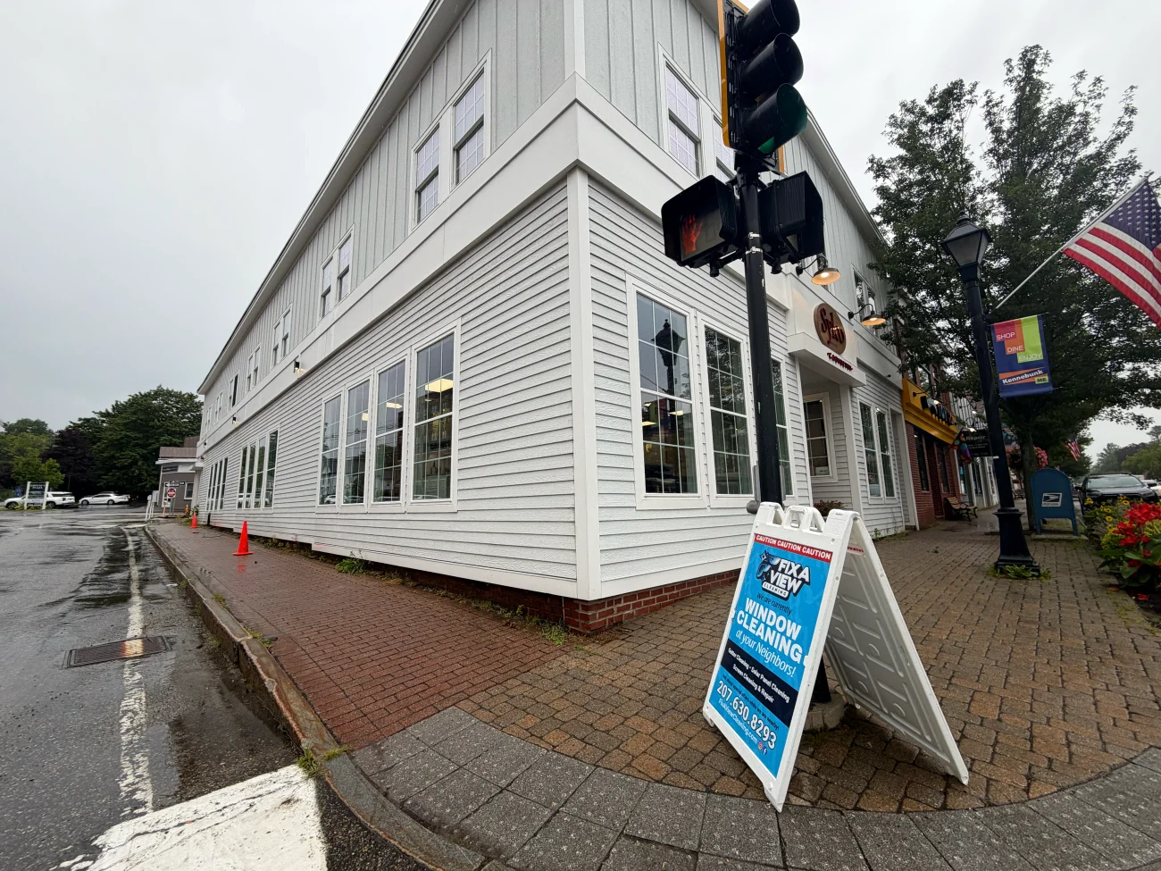 A downtown storefront with the Fix A View sign out front
