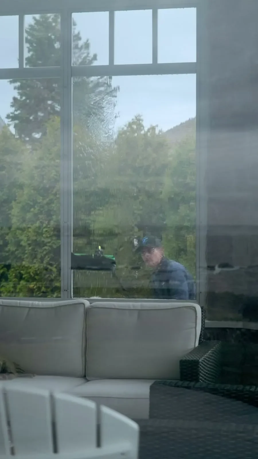 A full wall of glass being cleaned pane by pane